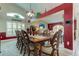 Bright dining room featuring a large wooden table and elegant chairs at 11426 Glenmont Dr, Tampa, FL 33635