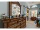 Ornate dresser in the main bedroom with coastal accents at 11426 Glenmont Dr, Tampa, FL 33635