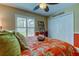 Bedroom with orange bedding and beach decor at 11426 Glenmont Dr, Tampa, FL 33635