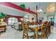 Bright dining room with a large table and view into the living room at 11426 Glenmont Dr, Tampa, FL 33635