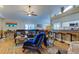 Relaxing living room with leather furniture, a large TV, and hardwood floors at 11426 Glenmont Dr, Tampa, FL 33635