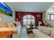 Living room featuring a large window and comfortable seating area at 11426 Glenmont Dr, Tampa, FL 33635