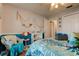 Bedroom with coastal decor and wicker chair at 11426 Glenmont Dr, Tampa, FL 33635