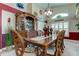 Elegant dining room with a beautiful hutch and a large wooden table at 11426 Glenmont Dr, Tampa, FL 33635