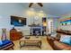Spacious living room with a fireplace, large TV, and plenty of seating at 11426 Glenmont Dr, Tampa, FL 33635
