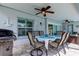 Covered patio with dining table, chairs, and grill at 11426 Glenmont Dr, Tampa, FL 33635