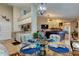 Open dining area with a glass-top table and chairs, overlooking the living room at 11426 Glenmont Dr, Tampa, FL 33635