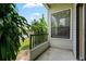 Small patio with metal railing and green space at 3127 W Sligh Ave # 104B, Tampa, FL 33614