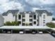 Three-story building with covered parking at 3127 W Sligh Ave # 104B, Tampa, FL 33614