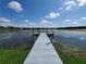 Private wooden dock extending into a calm lake at 3127 W Sligh Ave # 104B, Tampa, FL 33614