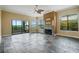 Spacious living room featuring a fireplace and sliding glass doors leading to a patio at 3127 W Sligh Ave # 104B, Tampa, FL 33614