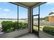 Spacious screened porch overlooking the lake at 3127 W Sligh Ave # 104B, Tampa, FL 33614
