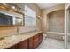 Bathroom with a glass shower and granite vanity at 3127 W Sligh Ave # 104B, Tampa, FL 33614