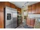 Kitchen boasts stainless steel appliances and wood cabinets at 3127 W Sligh Ave # 104B, Tampa, FL 33614