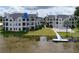 Condo community with pool, dock, and lakefront access at 3127 W Sligh Ave # 104B, Tampa, FL 33614