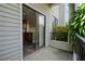 Private balcony with kitchen and partial lake view at 3127 W Sligh Ave # 104B, Tampa, FL 33614