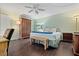 Spacious bedroom with dark hardwood floors and a ceiling fan at 19725 Gulf Blvd # 102, Indian Shores, FL 33785