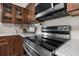 Stainless steel stove top and microwave in updated kitchen at 2452 Chaucer St, Clearwater, FL 33765