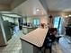 Kitchen features a breakfast bar and ample counter space at 1728 W Lagoon Cir, Clearwater, FL 33765