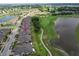 Aerial view of the neighborhood near a golf course and lake at 806 Chipper Dr, Sun City Center, FL 33573