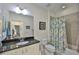 Bathroom featuring vanity with dark countertop, a toilet, and a shower with a decorative curtain at 806 Chipper Dr, Sun City Center, FL 33573