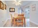 Bright dining area with wooden table and chairs at 12760 Indian Rocks Rd # 1004, Largo, FL 33774