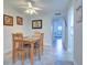 Small dining area with wooden table and chairs at 12760 Indian Rocks Rd # 1004, Largo, FL 33774