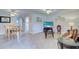 Open concept living and dining area with tile floors at 12760 Indian Rocks Rd # 1004, Largo, FL 33774