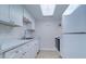 Clean kitchen with white cabinets and marble counters at 12760 Indian Rocks Rd # 1004, Largo, FL 33774