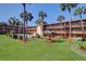 Lush green courtyard with picnic tables and building view at 12760 Indian Rocks Rd # 1004, Largo, FL 33774