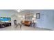 Bright living room featuring a sofa and flat-screen TV at 12760 Indian Rocks Rd # 1004, Largo, FL 33774