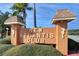 New Atlantis Club entrance sign with seahorse accents at 12760 Indian Rocks Rd # 1004, Largo, FL 33774