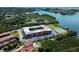 Aerial view of waterfront community with tennis court and pool at 12760 Indian Rocks Rd # 1004, Largo, FL 33774
