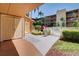 Pathway to the building with tropical landscaping at 12760 Indian Rocks Rd # 1004, Largo, FL 33774