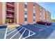 Condo building with parking and landscaped grounds at 12760 Indian Rocks Rd # 1004, Largo, FL 33774