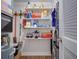 Well-organized laundry room with shelving for storage at 12760 Indian Rocks Rd # 1004, Largo, FL 33774