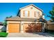 Two-story house with two-car garage and landscaped lawn at 14211 Edinburgh Moor Dr, Wimauma, FL 33598