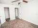 Well-lit bedroom with neutral walls and carpet at 14211 Edinburgh Moor Dr, Wimauma, FL 33598