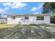 Backyard view of home's exterior with grass at 1232 Pineview Ave, Clearwater, FL 33756