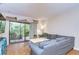 Relaxing living room with a sectional sofa and views to a private balcony at 10100 Sailwinds N Blvd # 205, Largo, FL 33773