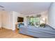 Spacious living room with a comfy sectional sofa and access to a private balcony at 10100 Sailwinds N Blvd # 205, Largo, FL 33773