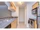 Modern kitchen featuring stainless steel appliances and wood cabinets at 10100 Sailwinds N Blvd # 205, Largo, FL 33773