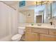 Clean bathroom with a shower/tub combo and light wood vanity at 10100 Sailwinds N Blvd # 205, Largo, FL 33773