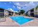 Refreshing community pool with surrounding lounge chairs at 10100 Sailwinds N Blvd # 205, Largo, FL 33773