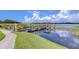 Relaxing lakeside path with a pier and gazebo at 10100 Sailwinds N Blvd # 205, Largo, FL 33773