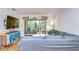 Bright living room featuring a sectional sofa and access to a private balcony at 10100 Sailwinds N Blvd # 205, Largo, FL 33773
