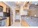 Efficient kitchen with stainless steel appliances and laundry at 10100 Sailwinds N Blvd # 205, Largo, FL 33773