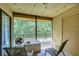 Relaxing screened balcony with string lights and outdoor furniture at 10100 Sailwinds N Blvd # 205, Largo, FL 33773