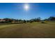 Golf course view with a golf cart and blue flag at 2241 Shelly Dr # B, Palm Harbor, FL 34684