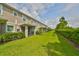 Backyard with grassy lawn and privacy hedge at 6378 Camino Dr, Apollo Beach, FL 33572